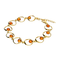 Joli Beau Gold-Plated Cognac Baltic Amber Bead Situated Off Centre Within A Circle Bracelet